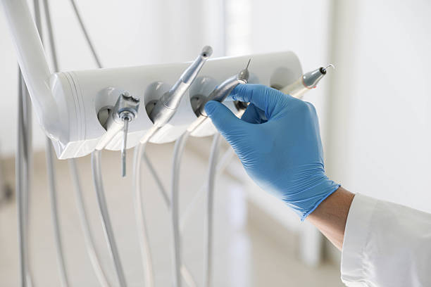 Professional Tooth Extraction technician working in Glen Cove, NY